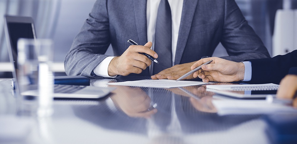 DuFault Law attorneys at pre-trial conference in Naples, Florida specializing in real estate law, construction law, and personal injury litigation