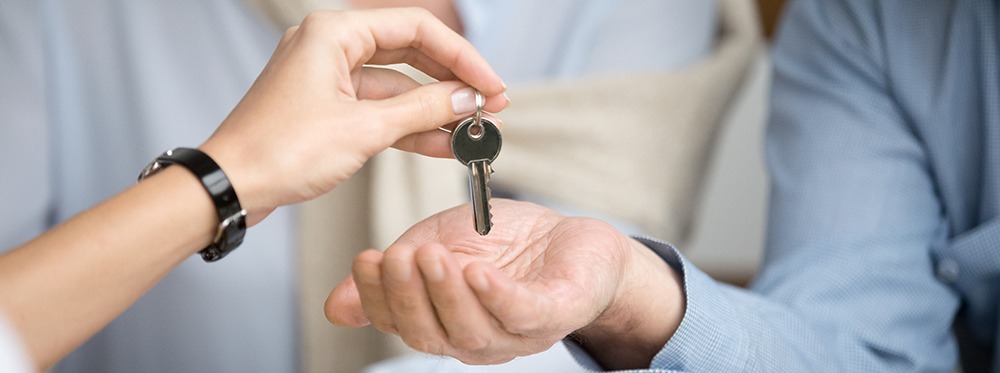Florida real estate attorney assisting clients with title insurance and real estate closing documents in Naples law office
