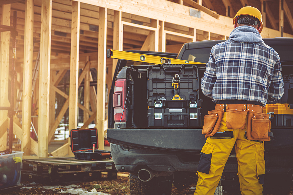 Florida construction law attorney reviewing building plans with a contractor to resolve disputes over defects, contracts, and liability issues.